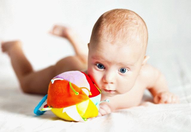 When a child begins to hold his head