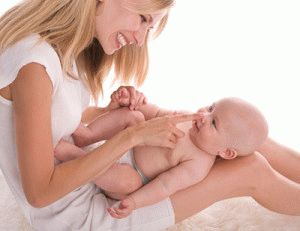 when the baby starts smiling at mom