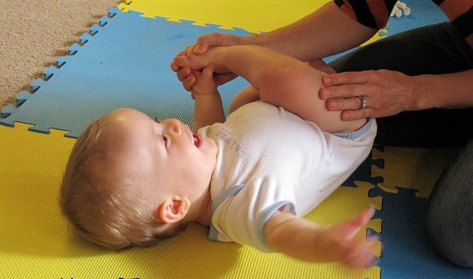 teach baby roll over