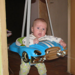 child in hanging jumpers