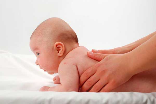newborn baby on his stomach