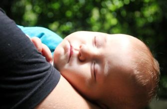 a baby’s sleep in mom’s arms