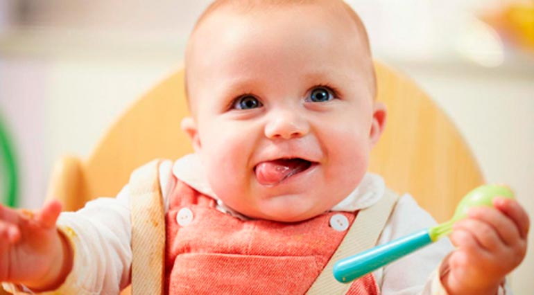 How to teach a child to eat with a spoon