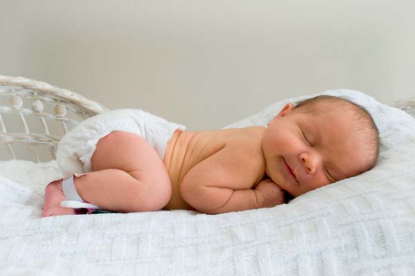baby sleeps on his stomach