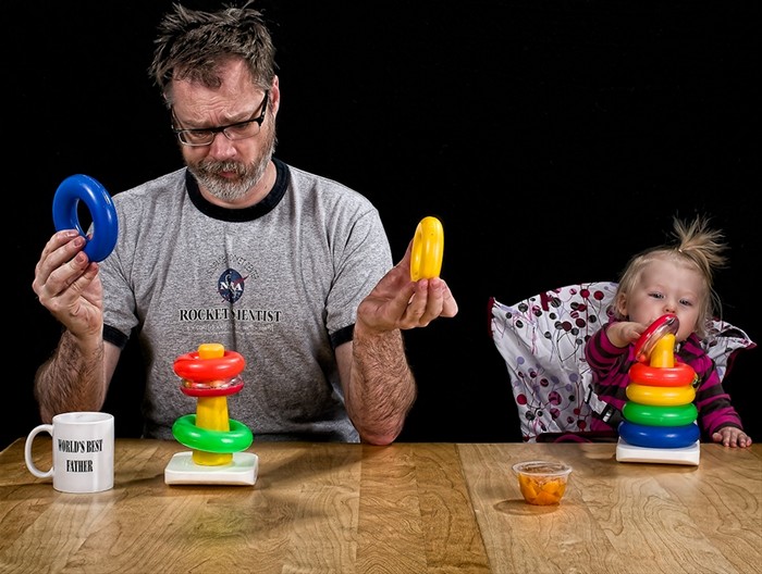 dad plays with the baby
