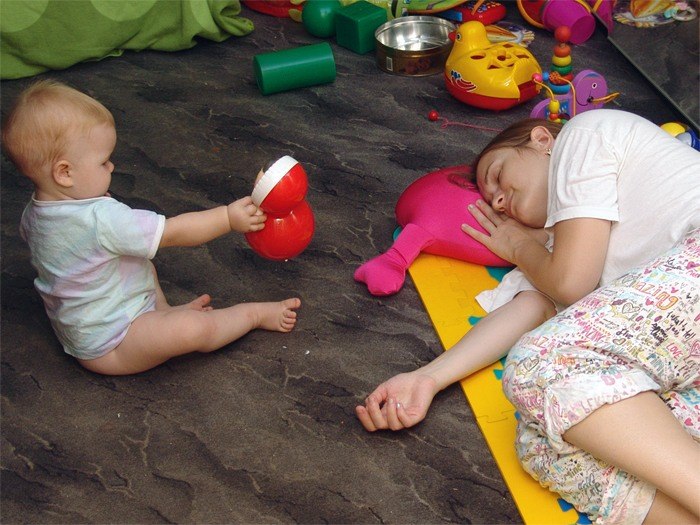 baby plays mom sleeps