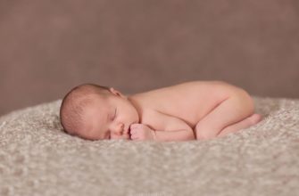 newborn sleeping on belly