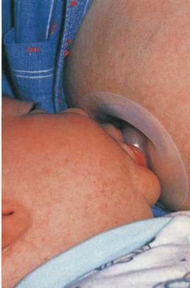 baby sucks breast with a lining