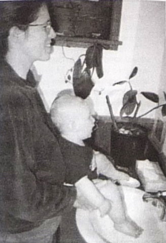 Basic posture: an adult stands with the child in front of him