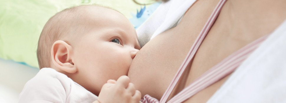 mother breastfeeds her baby