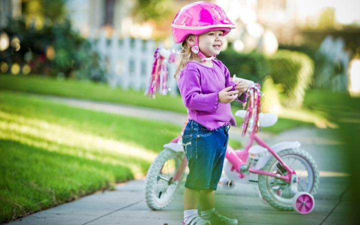 child on a bicycle in a helmet