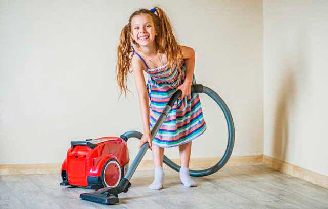 child with a vacuum cleaner