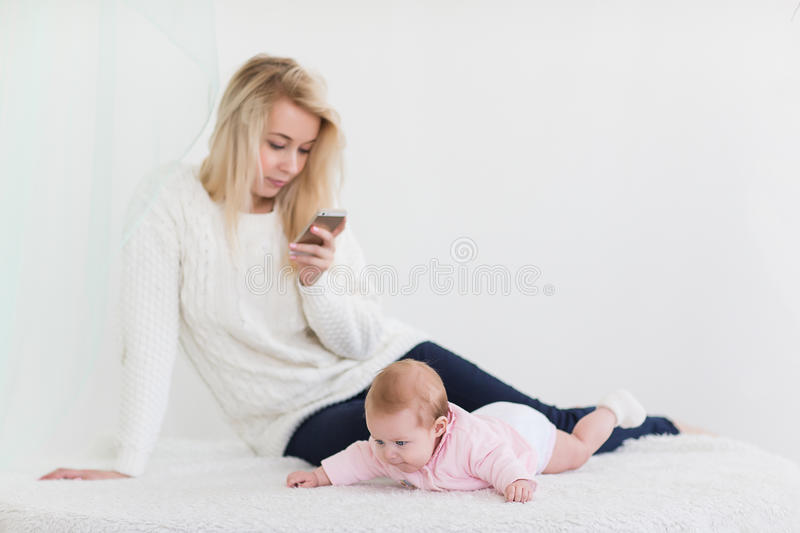 mom is sitting on the phone