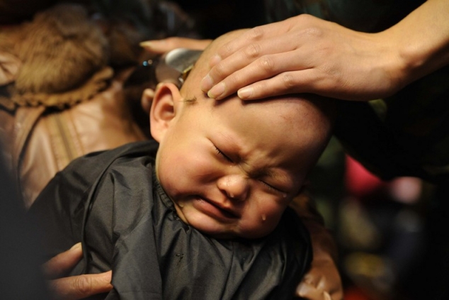 whether to cut the child's bald head per year