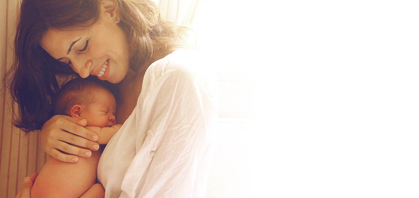 mom hugs baby