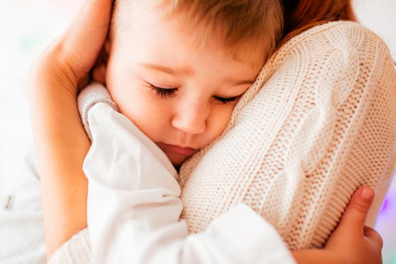 mom hugs baby