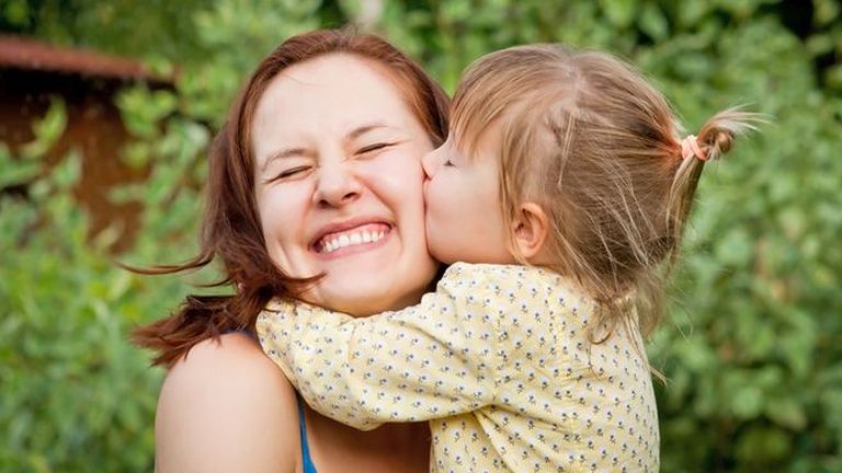 baby kiss mom
