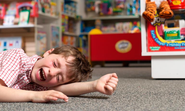child rolls a tantrum