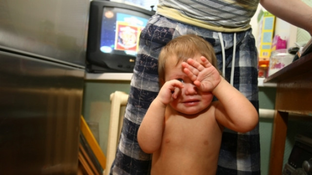 father scolds child