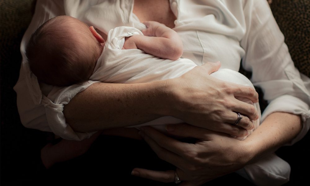 mother feeds the baby breast