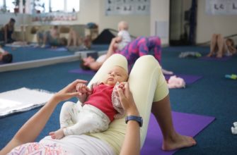 fitness with a baby in her arms