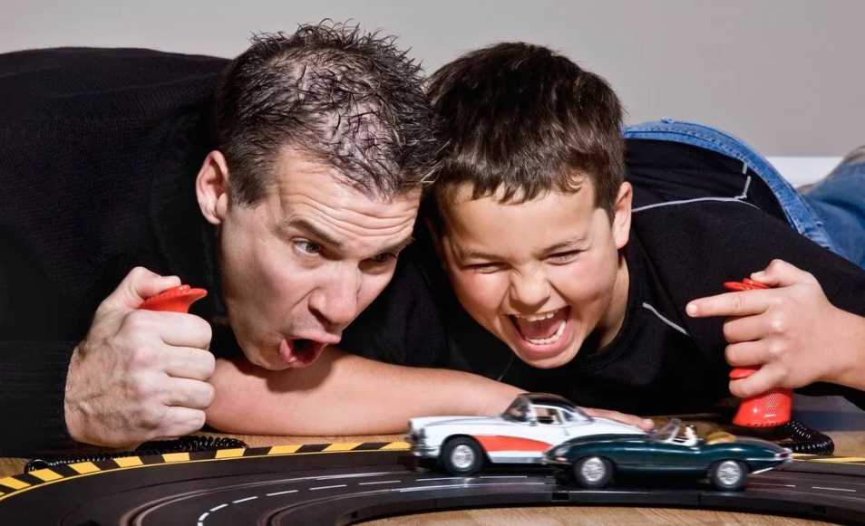 dad plays with baby