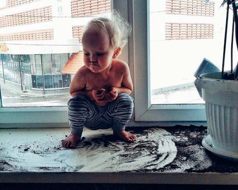 a child-pulling-out-of-a-pot-earth