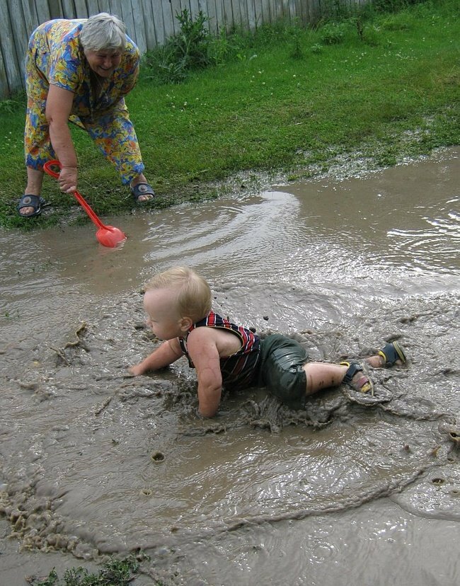 baby in a puddle